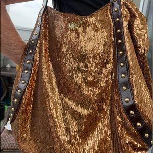 A gold/silver mermaid shoulder bag